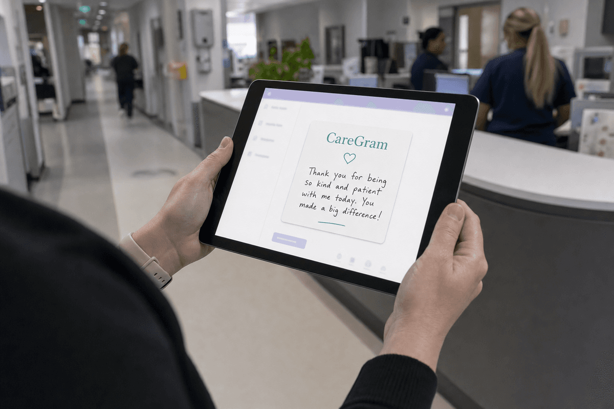 Nurse holding a tablet at a hospital nurses' station, viewing a CareGram thank-you message in brand teal accents
