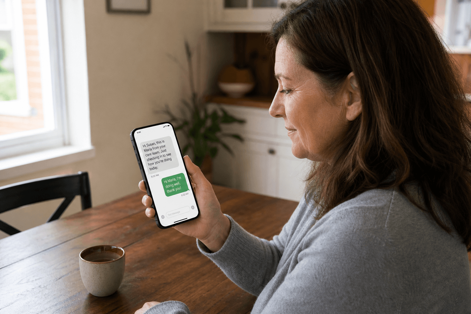 Patient at home reading a post-discharge SMS check-in from their care team.